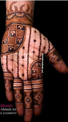 the hand is decorated with intricate designs