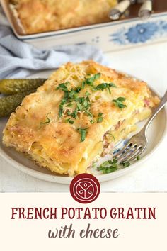 french potato gratin with cheese and herbs on a plate next to a casserole dish