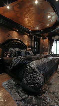 a large bed sitting inside of a bedroom on top of a hard wood floor