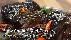 slow cooker beef cheeks in honey, soy garlic and butter sauce on a plate