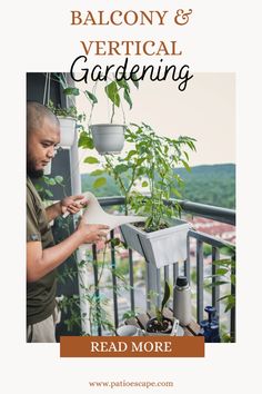 a man standing on top of a balcony next to a plant