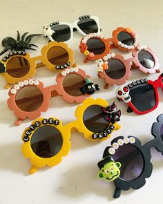 Limited edition! These Halloween insides sunglasses are SO cute! Add your littles name or a spooky saying in the personalize box at checkout. Each style sunglass comes as shown, we are not able to switch charms/colors of sunglasses.   ≫ PRODUCT DETAILS ◈ 1. All letters are capitalized in black font  ◈ 2: Use the personalize box at checkout to let us know NAME (or fun wording) ◈ 3. Lightweight but firm: these colorful sunglasses are made of resin lens and plastic frame, safe and reliable, lightwe Fun Party Sunglasses For Halloween, Fun Halloween Party Sunglasses, Cute Black Sunglasses With Uv Protection, Fun Black Halloween Sunglasses, Halloween Sunglasses With Tinted Lenses, Halloween Tinted Plastic Sunglasses, Halloween Tinted Sunglasses, Trendy Halloween Sunglasses With Gradient Lenses, Playful Black Plastic Sunglasses