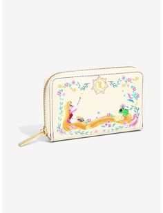 a small white purse with an image of two mermaids on the front and bottom