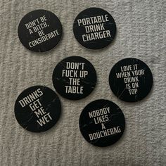 four black and white buttons with words on them that say drink me, don't f