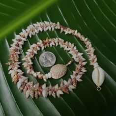 This necklace is a exquisite Kauai Laiki shell lei. Not only will this necklace maintain it's integrity and luster, it will continue to gain in value exponentially. The Laiki shells are only found on a few select beaches on Kauai and on the forbidden Island of Niihau. I collect all my shells on the north shores of the garden island of Kauai and sort each one by size, color, and quality. I then hand drill the holes in them in precisely the right place for this intricate and difficult weave. This Hawaiian Shell Necklaces, Shell-shaped Single Strand Jewelry Gift, Shell Shaped Single Strand Jewelry Gift, White Shell Oyster Bracelet, Spiritual White Shell Necklace, Shell-shaped Mother Of Pearl For Jewelry Making, Single Strand Shell Necklace, Ideal For Gifts, Shell Single Strand Necklace For Gift, Single Strand Shell Necklace For Gifts