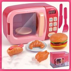 a pink toy microwave with food and utensils