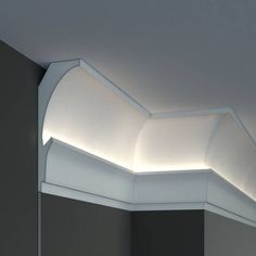 a white ceiling light in a room with grey walls