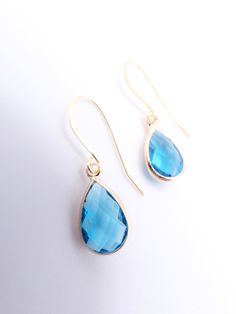 "Simply Gorgeous & classic!  These elegant lightweight drop dangle earrings feature dainty faceted light blue teardrop petite crystals on 18kt gold plated genuine 925 sterling silver fish hooks.  Dainty Faceted Light Blue Crystals / 18kt Gold Plated 925 Sterling Silver Fish Hooks MEASURES:  10mm Wide  x  1 1/8\" Long TEARDROP CRYSTAL:  10mm Wide  x  16mm Long 18KT GOLD PLATED STERLING SILVER LEVER FISH HOOKS ☆ Specifications: * Dainty Faceted Light Blue Teardrop Crystals * Approximate size  10mm Wide  x  1 1/8\" Long * 18kt Gold Plated 925 Sterling Silver Fish Hooks ☆ FREE SHIPPING WITHIN THE USA VIA USPS FIRST CLASS MAIL.  INTERNATIONAL SHIPPING IS ONLY $16.95 USD VIA USPS FIRST CLASS EXPEDITED INTERNATIONAL MAIL SERVICE. ☆ THANKS FOR LOOKING! ☆" Affordable Light Blue Metal Jewelry, Fish Hooks, Silver Fish, Blue Crystals, Hook Earrings, Gold Plated Sterling Silver, Jewelry Earrings Dangle, Dangle Drop Earrings, Dangle Earrings