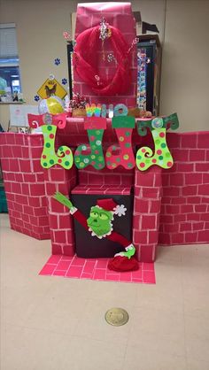 a pink castle made out of cardboard with the number seven on it and letters cut out