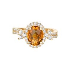 an orange and white diamond ring with two rows of diamonds around the band, set in yellow gold