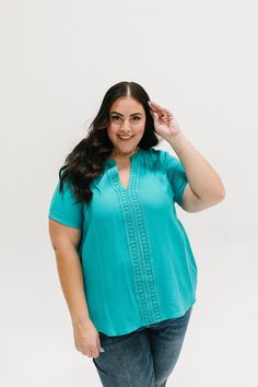 *ALL SALES FINAL* *NOT ELIGIBLE FOR RETURN* Get ready to stand out in the crowd with the Samantha Top! This lightweight and playful top features a trendy teal color and an open collar with a v-split neckline. The lace detailing on the front adds a touch of elegance, while the short sleeves with rolled cuffs make it perfect for any occasion. Fits true to size. Model is wearing a 1X and is 5'7". Size Chart Length Bust S 21.5" 36" M 22" 38" L 23" 40" 1x 26" 46" 2x 28" 48" 3x 28" 50" *All measuremen Casual Turquoise V-neck Blouse, Turquoise Short Sleeve Tops For Spring, Casual Turquoise Short Sleeve Blouse, Hanging Fabric, Teal Color, Teal Colors, Lace Detail, Size Chart, Short Sleeves