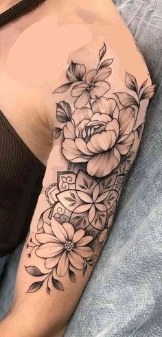 a woman with a flower tattoo on her arm