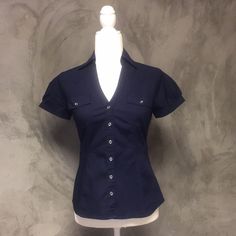 Express Essential Stretch Navy Blue Button Up Buckle Short Sleeve Blouse Nwot Size: Xsmall Shop With Confidence! Clean And Smoke Free Home And Boutique! Ships Same Day Or Next Business Day! All Items Are Handled And Shipped With Tlc! Blue Button Up, Blue Button Up Outfit, Organized Clothes, Hotel Closet, Sleeve Shirt Outfit, Thrift Board, 90’s Outfits, Clothes Board, Dark Blue Shirt