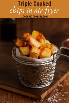 a basket filled with fried chips on top of a wooden table