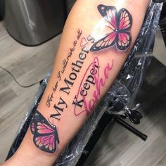 a woman's arm with two butterflies and the words i love my mother on it