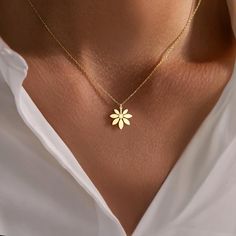 This elegant gold sunflower necklace features a minimalist floral pendant, perfect for adding a touch of nature to any outfit. A thoughtful gift for her, crafted with care. Our handmade silver necklaces make wonderful and delicate gifts for you.  Materials: -High Quality 925 Sterling Silver -18k Gold Plated Silver -18k Rose Gold Plated Silver Colors: -Gold -Rose Gold -Silver Please choose from options tag, if you would like a different color than the one shown in our pictures Packaging: All necklaces are carefully packaged and sent in a special gift box. We hope you find the perfect personalized necklace in our store. For more examples, please visit our store. Ordering Process: -Choose your preferred color and option. -Select the necklace length: Standard 16" or 12" for kids. -If you have Gold Minimalist Jewelry, Silver Gold Necklace, Thoughtful Gifts For Her, Sunflower Pendant, Sunflower Necklace, Floral Pendant, Sterling Silver Flowers, Elegant Floral, Dainty Jewelry