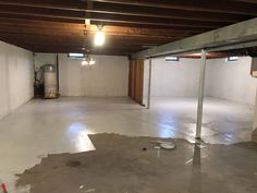 an empty garage with white walls and no one in the room or on the floor