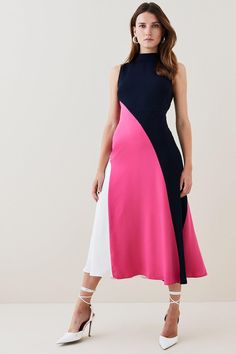 The Color-Block Trend Continues To Reign Supreme For Summer. Encapsulating The Look, This Rippling Midi Dress Blends Bold Swathes Of Color With A High-Low Hemline And Sleek, Sleeveless Silhouette. Sweep Into Your Next Special Soiree Wearing It, Adding Architectural Earrings For A Modern Finish.Style: Midi Dressdesign: Colour Blocklength: Midineckline: High Necksleeve Length: Sleeveless Two Tone Dresses, Bold Colors Outfits, Architectural Earrings, Colour Block Dress, Two Tone Dress, Leather Studio, Handbag Making, Karen Millen Dress, Color Block Skirt