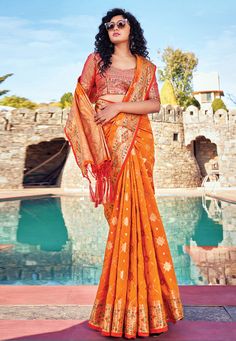 Orange banarasi silk festival wear saree 144469  Desc:  Style : Banarasi Sarees Color : Orange Fabric : Banarasi Silk Wash Care : Dry clean Sleeve Style : Half Sleeve Long Sleeves : Done only in Custom Stitch Sleeves Lining : Done only in Custom Stitch Bust Size : 32 to 42 Inches Occasion : Festival   Diwali   Eid   Durga Pooja   Ganesh Charturthi   Dussehra. With Express Free Shipping and Custom Stitching, Buy Indian Party wedding wear sarees Orange banarasi silk festival wear saree 144469 onli Indo Western Saree, Daytime Glam, Wedding Sarees Online, Silk Banarasi Saree, Look Festival, Frock Fashion, Modern Saree, Banarasi Silk Saree, Art Silk Sarees