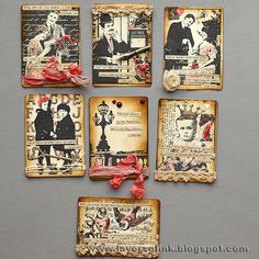 some old fashioned tags with pictures on them and ribbons tied to them in front of a gray background