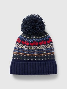 a knitted hat with a pom - pom on the front and side