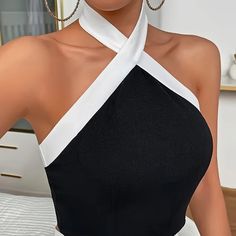 Elevate Your Wardrobe With Our Stylish Contrast Trim Backless Crisscross Tank Top In Black And White. Perfect For Any Occasion, This Top Features An Elegant Halter Neck And Sleeveless Design. The Backless Detail And Crisscross Straps Add Allure And A Trendy Twist To A Classic Silhouette. Made With High-Quality Materials, This Top Is Both Fashionable And Comfortable. Upgrade Your Look With This Versatile Piece That Will Turn Heads Wherever You Go. Xxl/14 Bust: 42.2-44.5in Waist: 34.3-36.6in Compo Stretch Sleeveless Cross-tied Halter Top, Chic Crisscross Straps Tank Top For Party, Sleeveless Bandage Tops For Night Out, Chic Sleeveless Bandage Tank Top, Chic Bandage Sleeveless Tank Top, Chic Sleeveless Bandage Crop Top, Chic Cross-tied Halter Top For Night Out, Chic Cross-tied Crop Top For Night Out, Sleeveless Bandage Top For Party