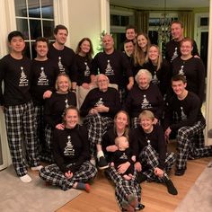 a group of people wearing matching christmas pajamas