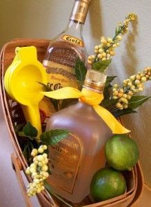 a basket filled with liquor bottles and fruit