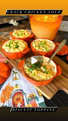 an orange bowl filled with food sitting on top of a wooden cutting board next to pumpkins