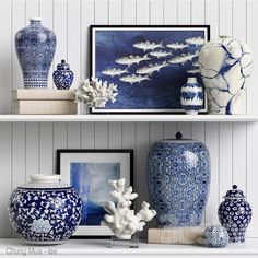 blue and white vases are on the shelves