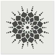 a black and white snowflake with circles on it's center, in the middle