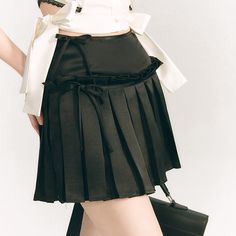 Pleated short skirt made of slightly glossy satin fabric. The waist part is decorated with a ribbon. The pleats hang from the middle of the skirt, giving it a sophisticated look. Goes great with short tops. 
 
 
 Size 
 
 S size 
 
 Total length: 38cm 
 Waist: 62cm 
 
 M size 
 
 Total length: 38.5cm 
 Waist: 66cm 
 
 L size 
 
 Total length: 39cm 
 Waist: 70cm 
 
 
 
 
 
 
 
 
 
 Material 
 
 Polyester 
 
 
 Model worn 
 
 Wearing size 
 
 S size 
 
 Model dimensions 
 
 Height: 163cm 
 Weight: Elegant Pleated Mini Skirt For Party, Elegant Pleated Mini Tennis Skirt, Pleated Mini Skirt For Summer Evenings, Elegant Party Mini Skirt With Pleated Hem, Satin Pleated Tiered Skirt, Elegant Pleated Tiered Skort, Party Mini Skirt With Pleated Hem, Evening Pleated Satin Skirt, Elegant Tiered Pleated Skort