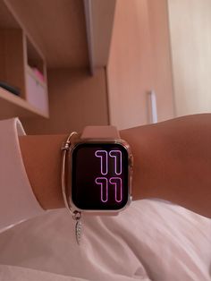 an apple watch with the time displayed on it's wrist in a hospital bed