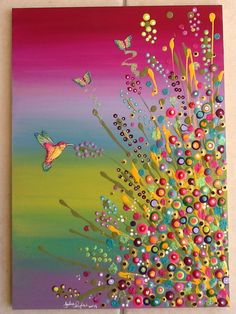 the painting is colorful and has lots of dots on it, as well as butterflies