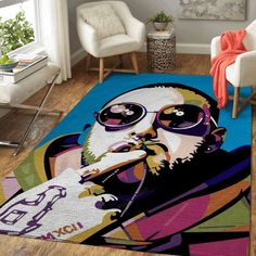 a living room with a rug that has a painting of a man wearing sunglasses on it