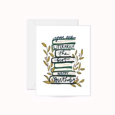 a card with an illustration of books stacked on top of each other and the words, you are literally happy birthday