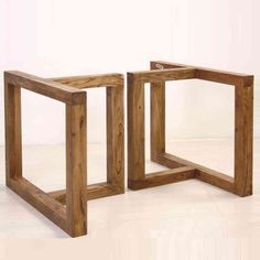 two square wooden tables sitting on top of a white floor