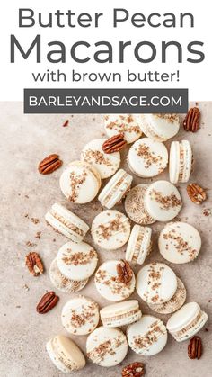 butter pecan macarons with brown butter and pecans scattered around them on a table