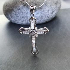 Silver Diamond Cross Pendant Jewelry, Diamond White Cross Pendant Necklace In Cubic Zirconia, Diamond White Cubic Zirconia Cross Pendant Necklace, Diamond White Cubic Zirconia Crucifix Necklace, Silver Cross Pendant Necklace With Diamond Accents, Sterling Silver Crucifix Necklace In Diamond White, Diamond White Cross Pendant Jewelry, Cross Necklace With Cubic Zirconia And Diamond Accents, White Gold Crucifix Necklace With Cubic Zirconia