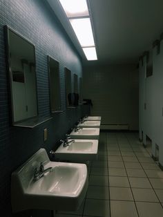 a row of sinks in a public restroom