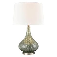 a green lamp with a white shade on it's base and a silver metal base