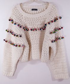 "Women's Sweater Handmade Boho Crocheted Knitted Excellent Vintage Women's Size L by ZARA KNIT BANGALADESH This Beautiful boho hippie chic sweater has a handmade woven crochet pattern in cream beige with 70's style colorful pom pom trim, long sleeves and shorter cool length. Super high quality. Heavy duty construction and materials. Excellent condition. Length- 20.5\" Bust- 25.x25\" Waist - 25\"x2 Sleeves- 24\"" Woven Crochet, Vintage High Waisted Shorts, Pom Pom Sweater, Sweater Handmade, Chic Sweater, Boho Hippie Chic, Boho Sweater, Floral Pocket, Long Sleeve And Shorts