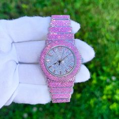 Step into elegance with this fully iced-out diamond timepiece that mirrors genuine luxury watches. We utilize premium simulated diamonds crafted from high-refractive crystals, ensuring a sparkle that rivals authentic diamonds under the light! INCLUDES AN EASY-TO-USE SIZE ADJUSTMENT TOOL Specifications: - Gender: Women's  - Case Size: 40mm - Movement: Quartz Movement - Battery: Included - Sizing: 6-inch band - Adjustable: Links are removable to fit your wrist - Back: Stainless Steel - Lock: Deployment Clasp - Stone: VVS Diamond Simulate - Case Material: Alloy - Finish: Silver Plating  Whether you're dressing up for casual days, or events, or gifting someone special on occasions like Graduations, Valentine's Day, Anniversaries, Birthdays, Thanksgiving, Christmas, New Year, or Mother's Day, t Diamond White Watches With Rhinestones For Gift, Pink Diamond Watch With Diamond Hour Markers, Diamond Watch With Rhinestones And Round Dial, Diamond White Iced Out Watches As Gift, Crystal Bling Watches, Gift Iced Out Diamond White Watch, Round Crystal Watches With Rhinestones, Crystal Round Watches With Rhinestones, Crystal Watches With Rhinestones