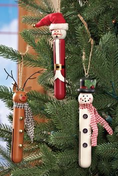 three christmas ornaments hanging from a tree in the shape of santa clause and snowman