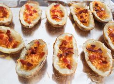 baked potato skins with bacon and cheese on a baking sheet, ready to be eaten