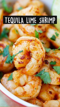 grilled tequila lime shrimp in a bowl with cilantro garnish