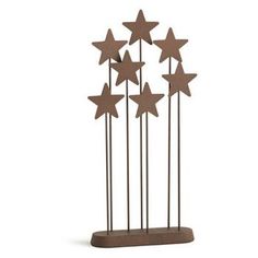 a metal sculpture with five stars on it's sides and four smaller ones in the middle