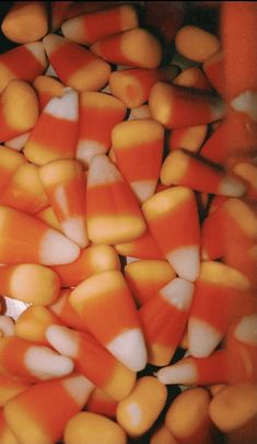 candy corn in a bowl with a spoon