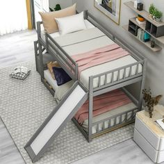 a bunk bed with a slide down the side to allow children to sleep in it