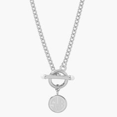 Inspired by preppy classics, the Stella Pearl Toggle Necklace is an engravable necklace that combines several of our favorite details. The pearl accented toggle is a stylish way to keep this necklace secure and the pendant can be personalized with either your initials or your monogram in your choice of engraving styles. Available in 14k gold plated, rhodium plated or 14k rose gold plated brass Pendant size: 1/2" 18" curb chain Simulated 3mm pearl Toggle closure With engraving this item is FINAL Engravable Necklace, Tennis Jewelry, Toggle Necklace, Great Gifts For Mom, Engraved Necklace, The Pearl, Brass Pendant, Curb Chain, Watches Jewelry